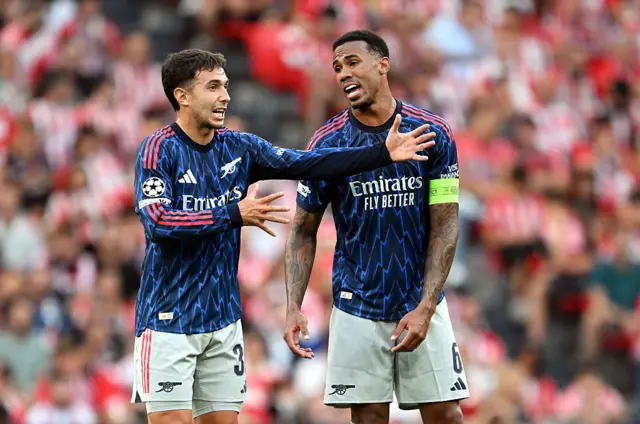 Martin Zubimendi and Gabriel of Arsenal speak during the UEFA Champions League 2025/26 League Phase MD1 match between Athletic Club and Arsenal FC at Estadio de San Mames on September 16, 2025 in Bilbao, Spain.