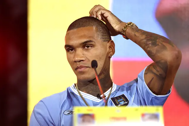 Conor Benn scratches his head at a news conference
