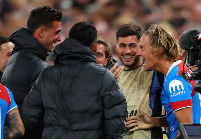 Atletico Madrid's Marcos Llorente celebrates scoring their second goal with teammates