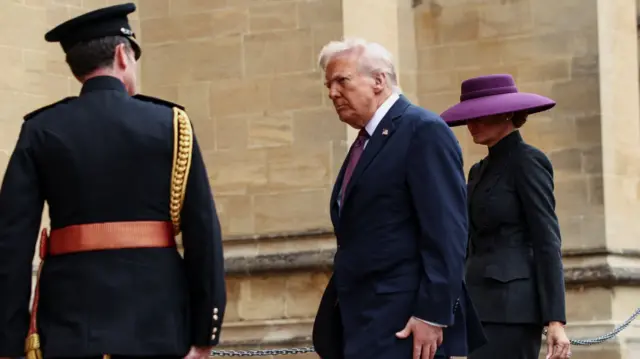 Trump and Melania are greeted at the entrance to St George's Chapel
