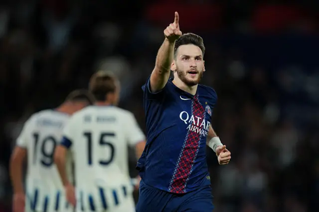 Khvicha Kvaratskhelia of Paris Saint-Germain celebrates scoring his team's second goal