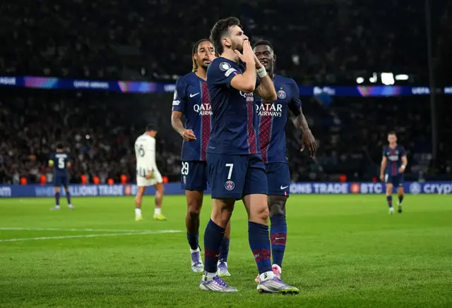 Khvicha Kvaratskhelia of Paris Saint-Germain celebrates scoring his team's second goal