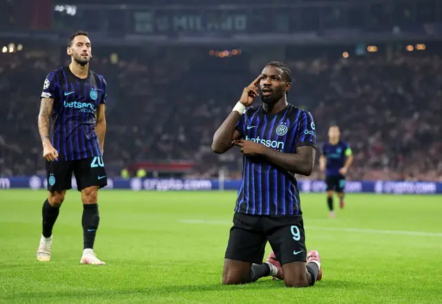 Marcus Thuram of Internazionale celebrates scoring his team's first goal during the UEFA Champions League 2025/26 League Phase MD1 match between AFC Ajax and FC Internazionale Milano at Johan Cruijff Arena on September 17, 2025 in Amsterdam, Netherlands.