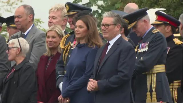 Keir Starmer stands at military procession