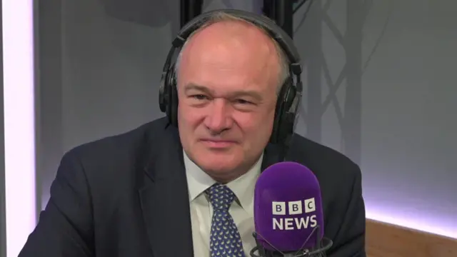 Ed Davey giving a radio interview