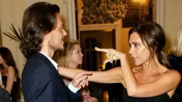 Matthew Williams and Victoria Beckham at a drinks reception in Winfred House
