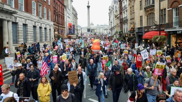 People take part in a 'Trump Not Welcome' protest during the state visit of U.S. President Donald Trump and first lady Melania Trump, as