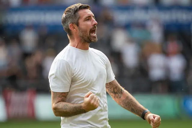 Swansea City head coach Alan Sheehan celebrates