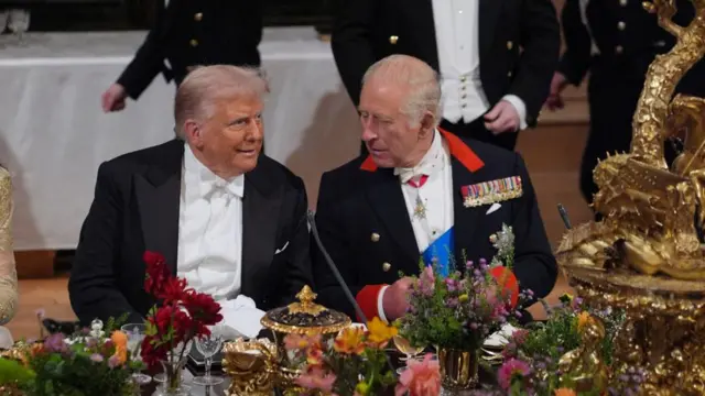 Trump and Charles speaking at the banquet table