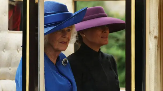 Queen Camilla and Melania Trump in the back of a coach