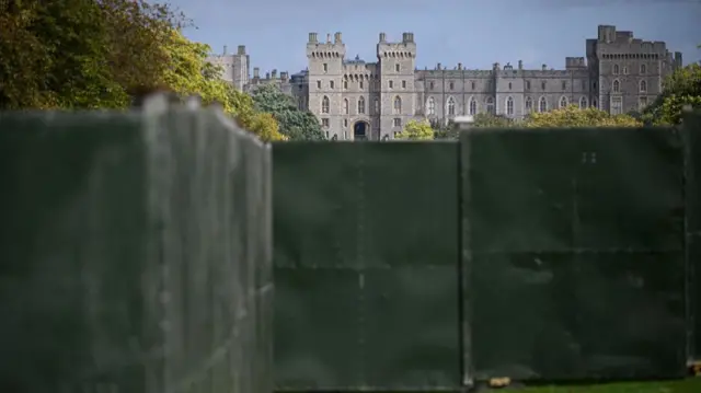 Windsor Castle is seen in the distance, beyond a large "ring of steel" security fence surrounding sections of the Long Walk, ahead of the State Visit later this week