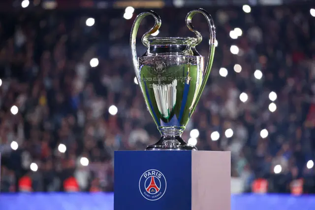 Champions League trophy on a PSG stand