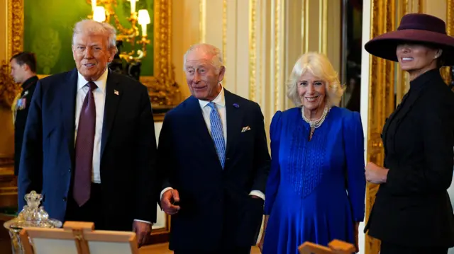 The King and Queen are joined by the President and First Lady as they stand in front of the special exhibiiton.
