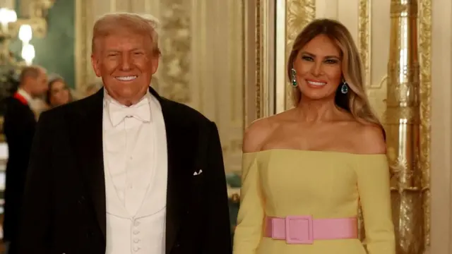 U.S. President Donald Trump and first lady Melania Trump pose for a photo at the State Banquet.