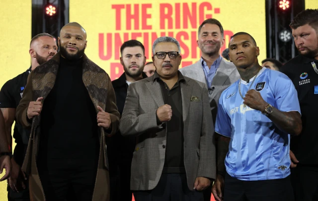 Chris Eubank Jr smirks posing for pictures with Conor Benn