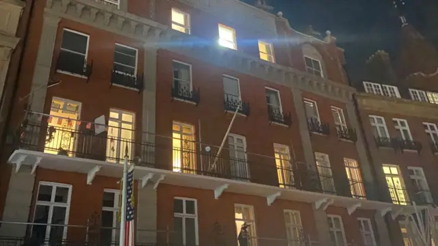 The Harte & Garter Hotel front, a US and UK flag are visible - and one of the hotel windows on the top floor is brightly illuminated