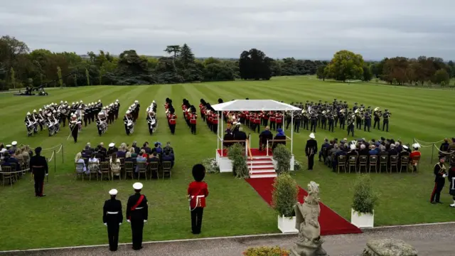 US President Donald Trump, First Lady Melania Trump, King Charles III and Queen Camilla sit during a Beating Retreat military ceremony at Windsor Castle.