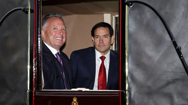 US Secretary of State Marco Rubio and US Special Envoy Steve Witkoff travel in the Ascot Landau carriage during a horse-drawn procession towards Windsor Castle, in Windsor, on September 17, 2025, during a second State Visit.