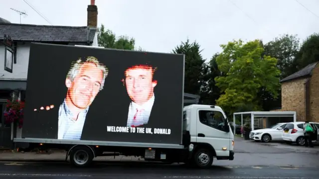 Epstein and Trump photograph displayed on truck in Windsor.