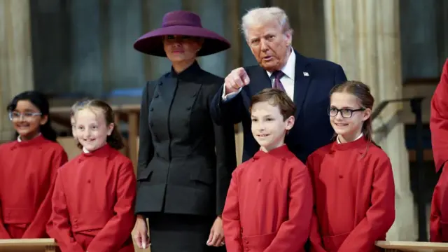 Trump and Melania stood with a choir in St George's Chapel.
