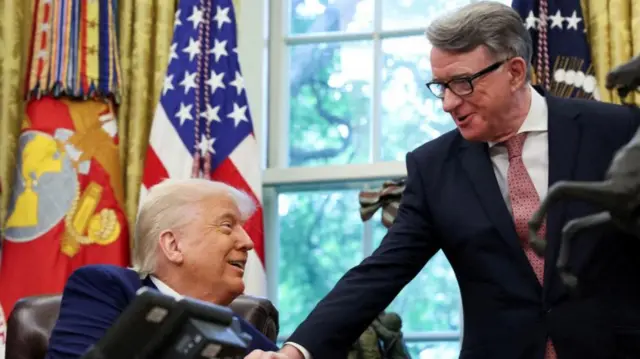 U.S. President Donald Trump shakes hands with Britain's ambassador to the United States, Peter Mandelson after announcing a trade deal with the U.K., in the Oval Office at the White House in Washington, D.C., U.S., May 8, 2025.