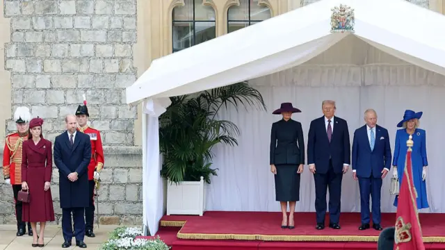 King Charles, the Queen, Donald Trump and Queen on a raised stage