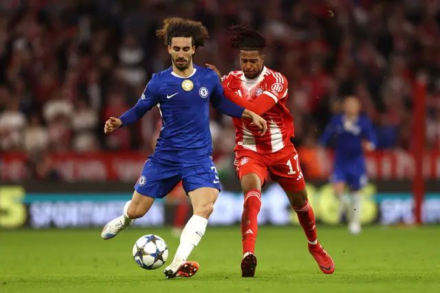 Marc Cucurella of Chelsea is put under pressure by Michael Olise of Bayern Munich