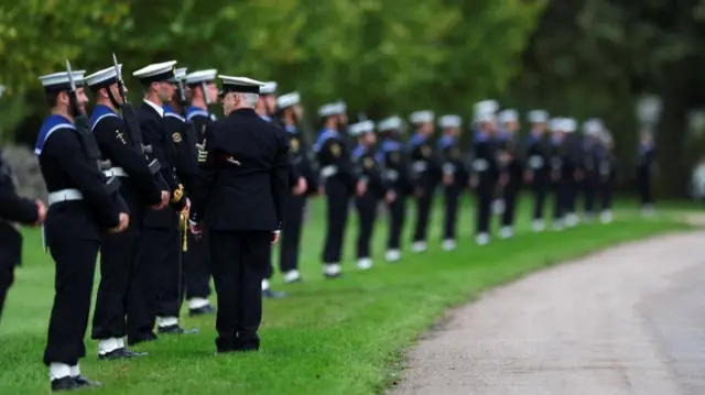 Members of the Royal Navy Ceremonial Guard line up the route ahead of a carriage procession through Windsor Castle