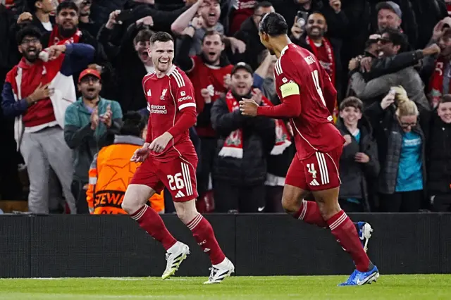 Liverpool's Andrew Robertson (left) celebrates with Virgil van Dijk