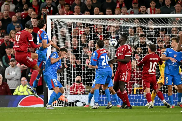 Liverpool's Dutch defender #04 Virgil van Dijk scores his team's third goal