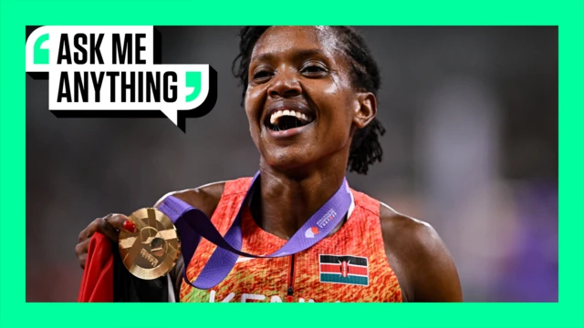 Faith Kipyegon of Kenya celebrates with her gold medal after winning the women's 1500m final