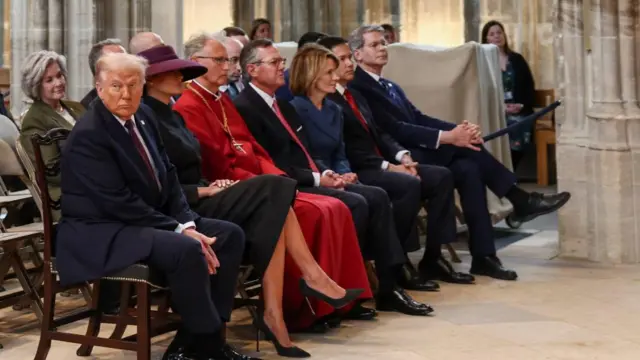 President Trump sits in a pew with Melania and Rubio