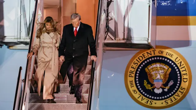 Melania Trump and Donald Trump walking down from Air Force One after landing in the UK