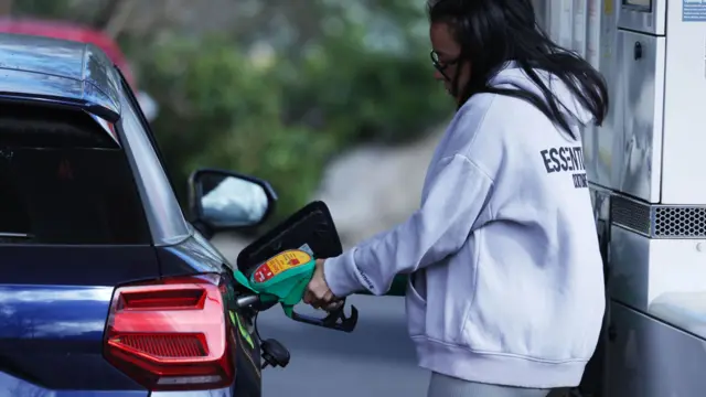 A person buying petrol