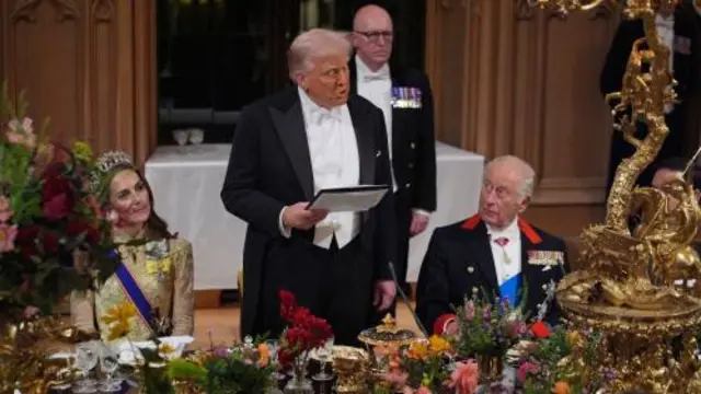 US President Donald Trump delivers his speech as King Charles III and the Princess of Wales listen during the state banquet for the US President and First Lady Melania Trump