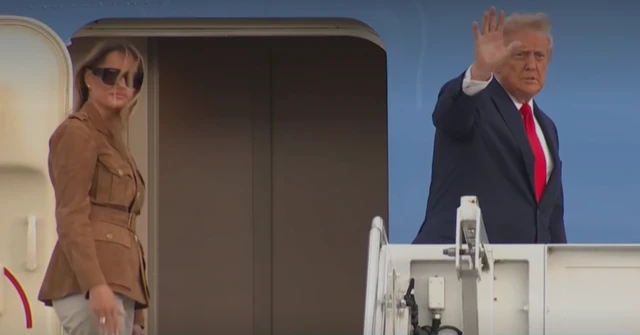 Melania and Donald Trump boarding airplane.