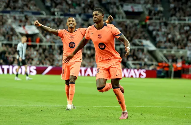Marcus Rashford (R) of Barcelona celebrates after scoring his second goal