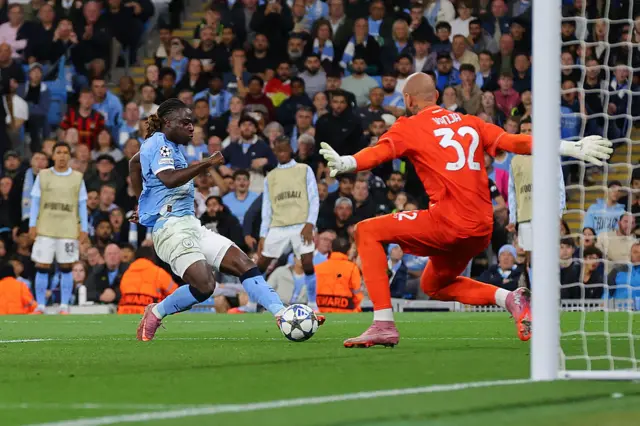 Jeremy Doku of Manchester City scores their side's second goal