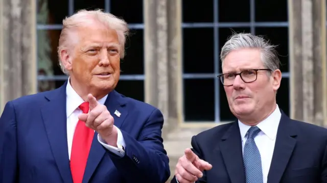 Trump and Starmer in suits, pointing fingers away from them.