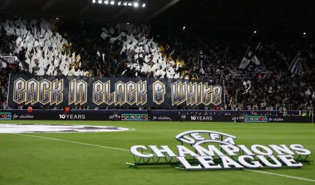 Newcastle United fans make a display in the stands before the match
