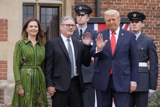 Keir Starmer, Lady Starmer and Trump wave to cameras as they first meet.