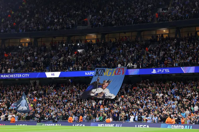 A 'King Kev' flag is displayed by fans for Kevin De Bruyne of Napoli (not pictured) prior to the UEFA Champions League 2025/26 League Phase MD1 match between Manchester City and SSC Napoli at City of Manchester Stadium on September 18, 2025 in Manchester, England.