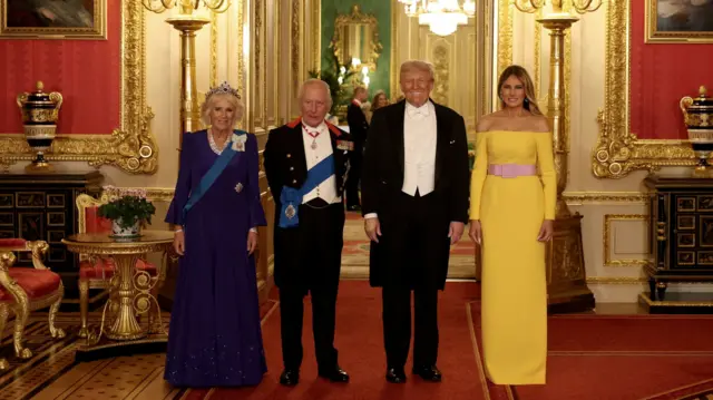 King Charles III and Queen Camilla (L) with US President Donald Trump and First Lady Melania Trump (R) pose for a photo at the state banquet for the president and his wife at Windsor Castle