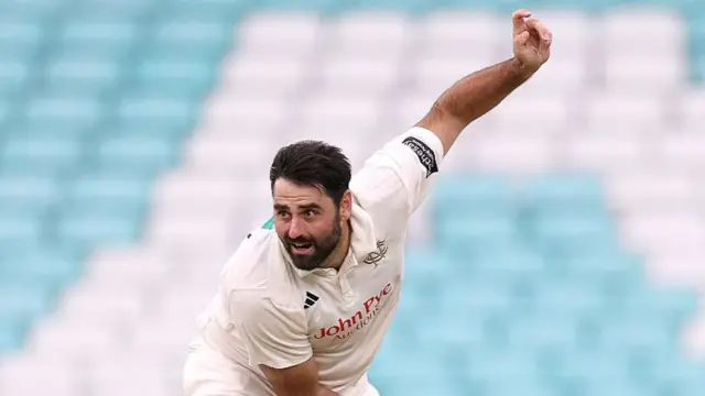 Brett Hutton bowling for Notts at Surrey