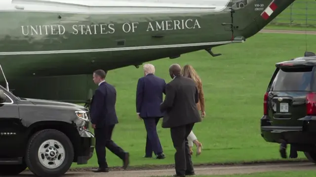 Donald and Melania Trump walk towards Marine One helicopter