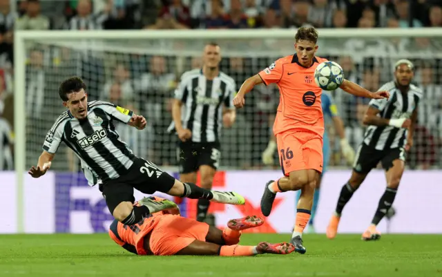 FC Barcelona's Marcus Rashford in action with Newcastle United's Tino Livramento