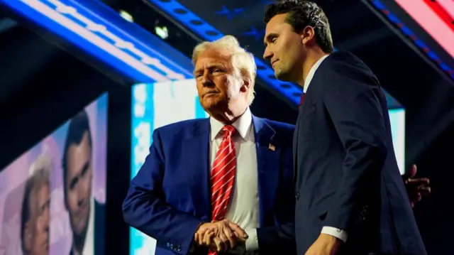 Donald Trump and Charlie Kirk shaking hands