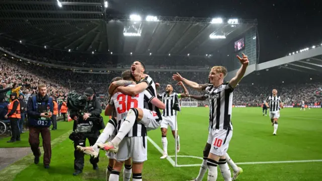 Newcastle players celebrate against PSG