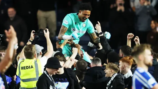 Shamal George celebrates with St Mirren fans