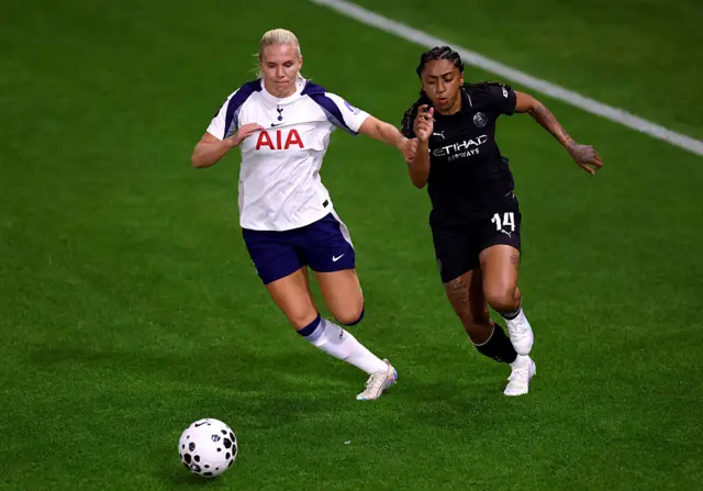 Kerolin Nicoli Israel Ferraz of Manchester City runs with the ball whilst under pressure from Josefine Rybrink of Tottenham Hotspur during the Barclays Women's Super League match between Tottenham Hotspur and Manchester City at BetWright Stadium